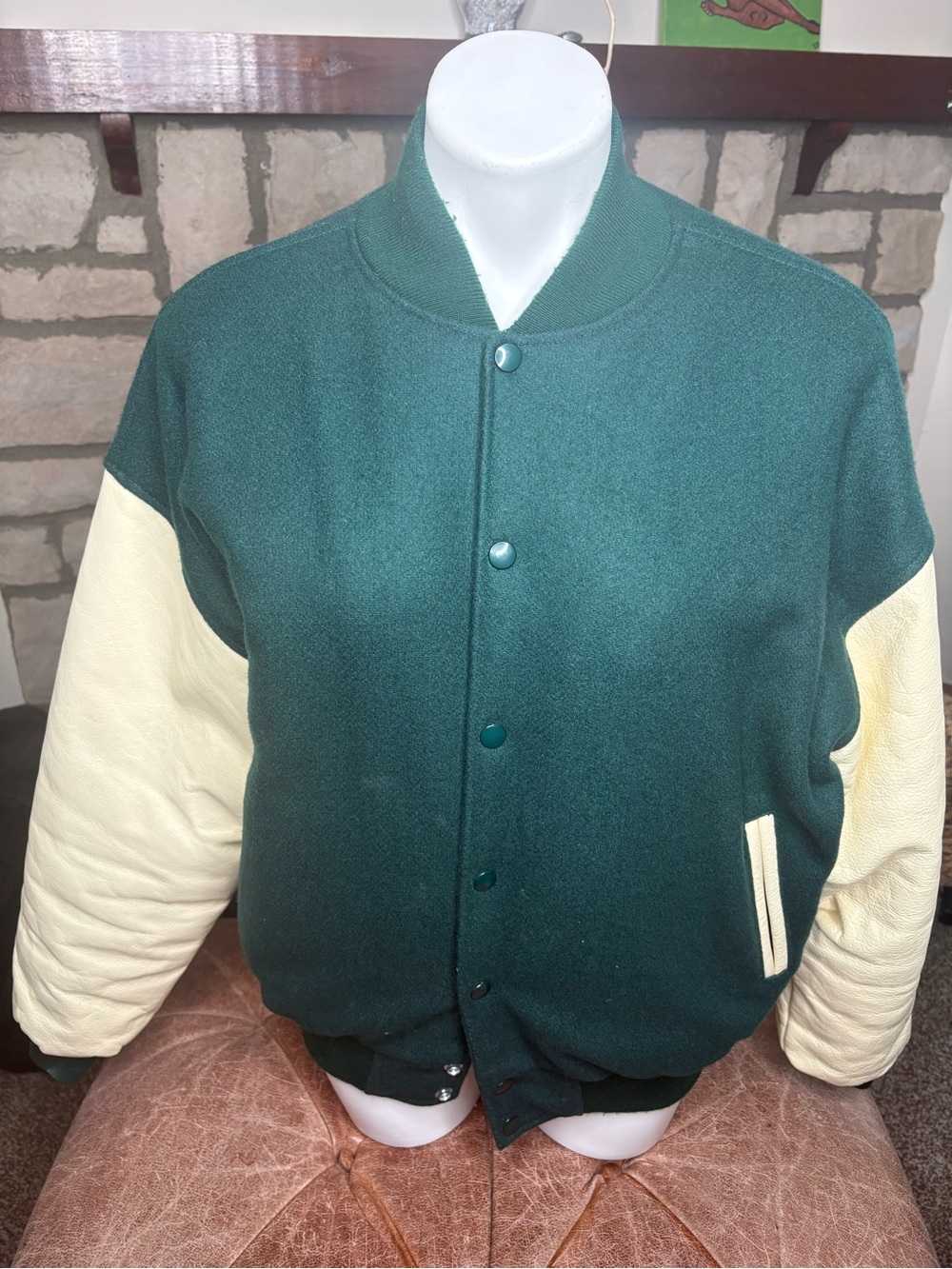Green and white varsity jacket